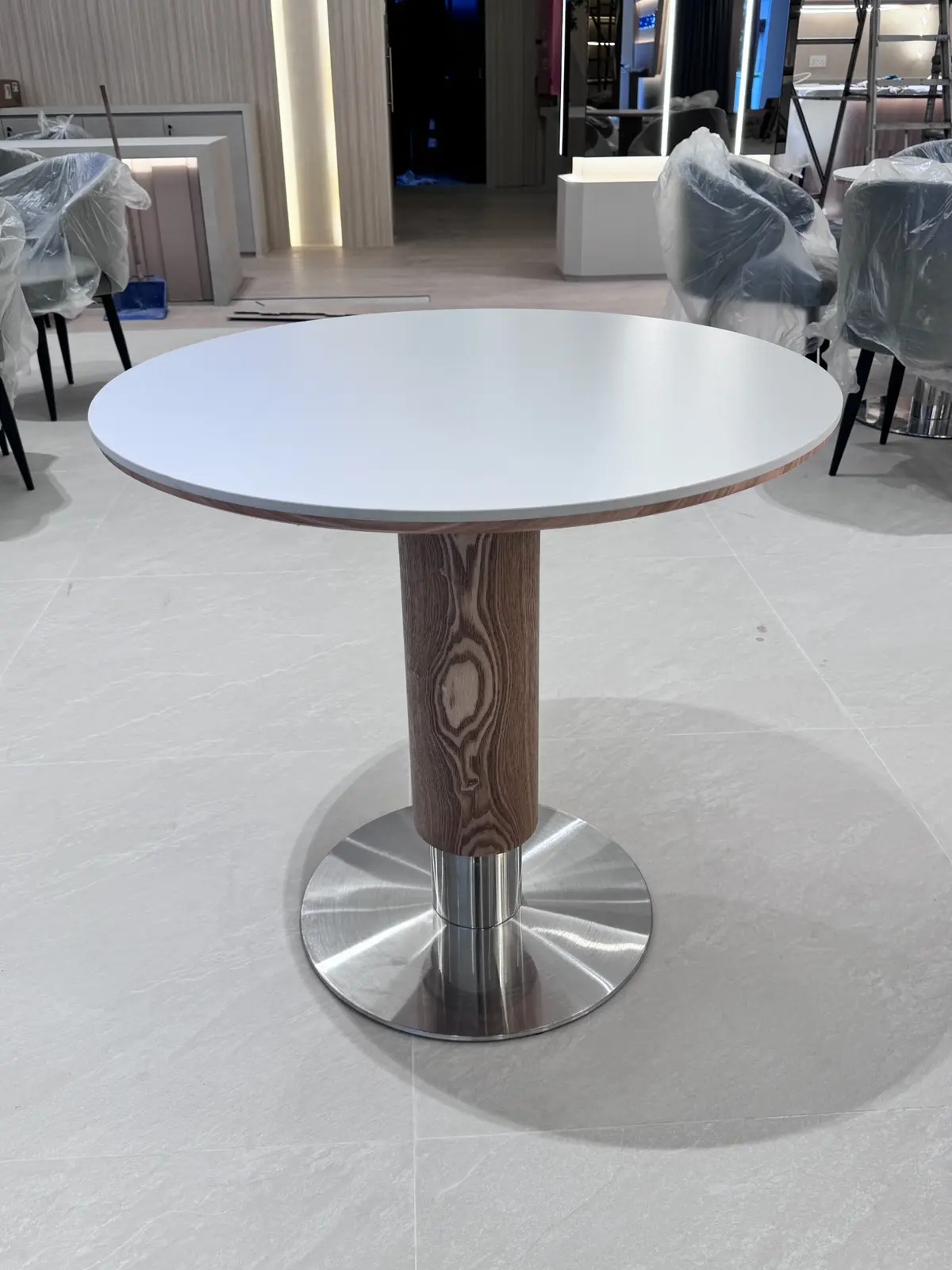 Round café-style table supplied for the Suzuki showroom customer area