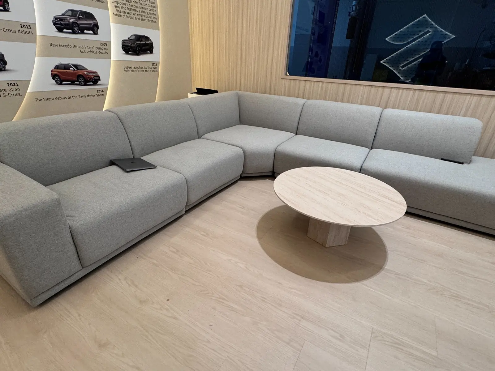 Modular sofa and coffee table arrangement in the Suzuki showroom lounge