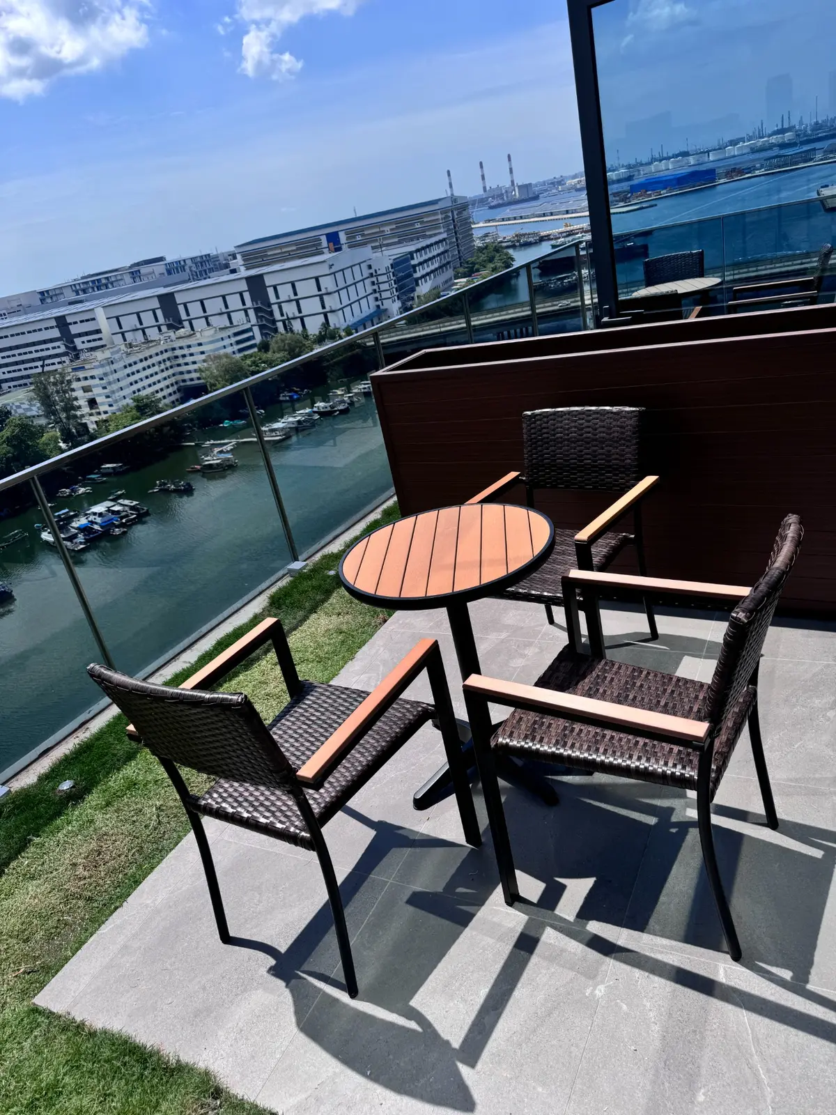 Compact outdoor cafe table and chairs on a high-rise office terrace