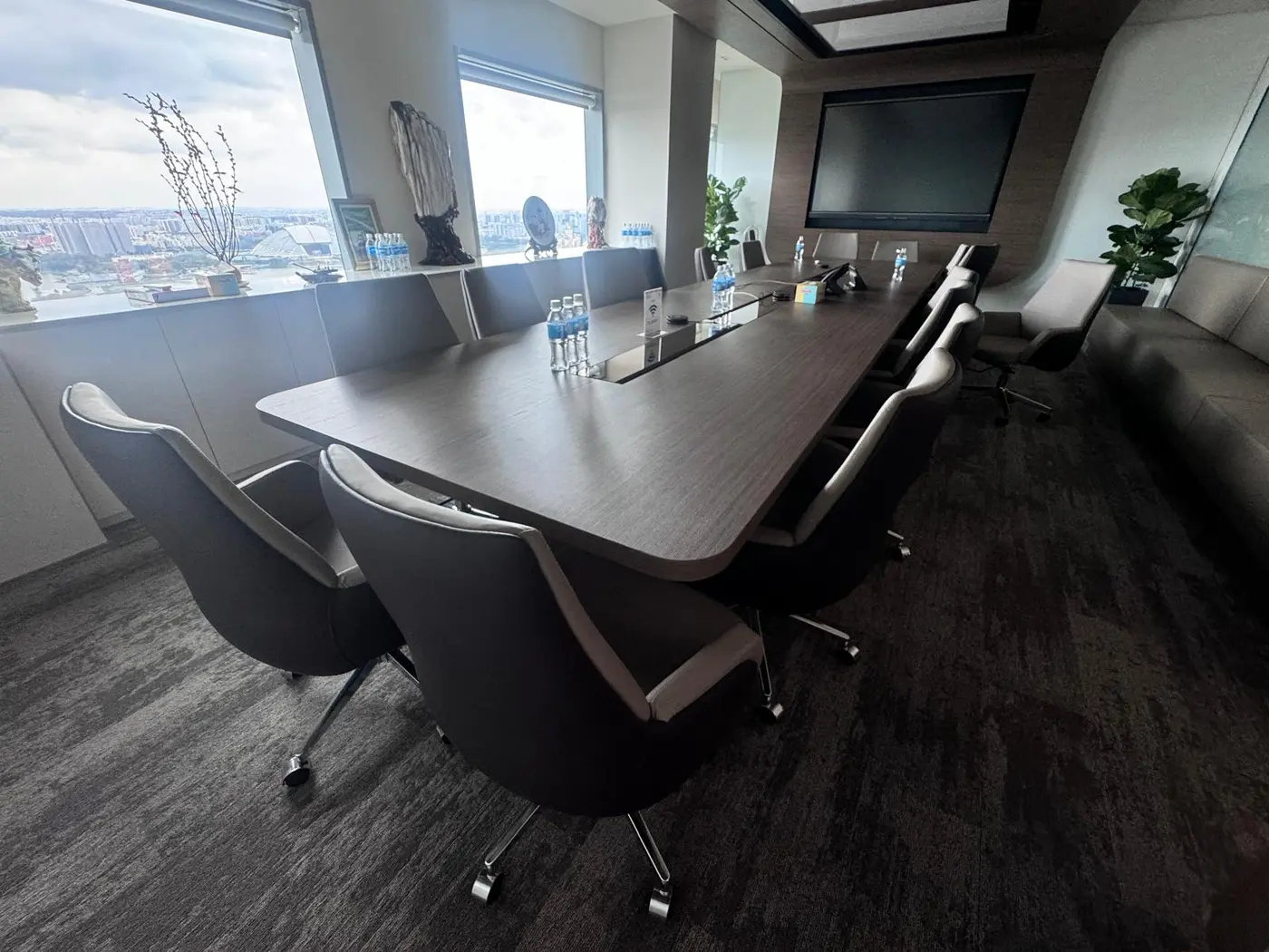 Large completed boardroom overlooking Singapore