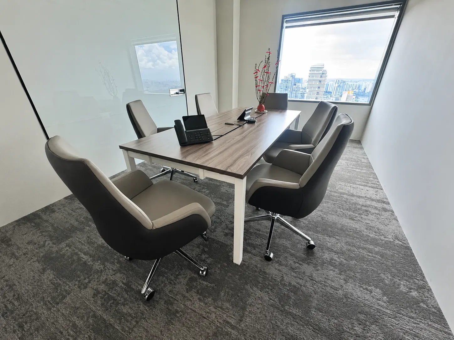 Completed office meeting room with conference table and chairs