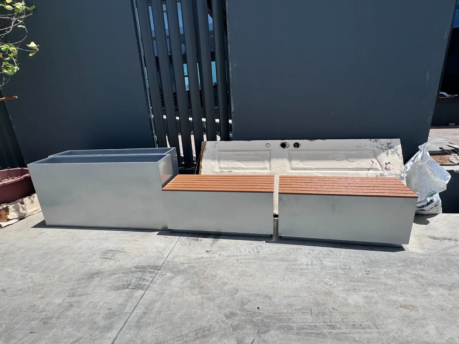 Custom planter bench with timber seating for an office outdoor area
