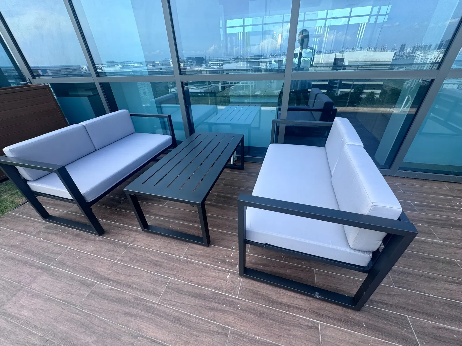 Office rooftop lounge suite with two sofas and a matching coffee table