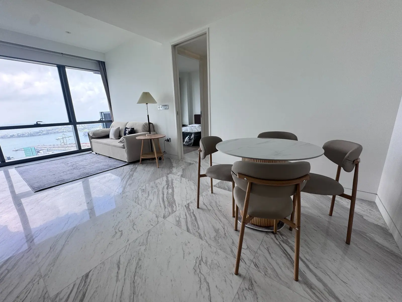 Round dining set overlooking a coordinated apartment living area