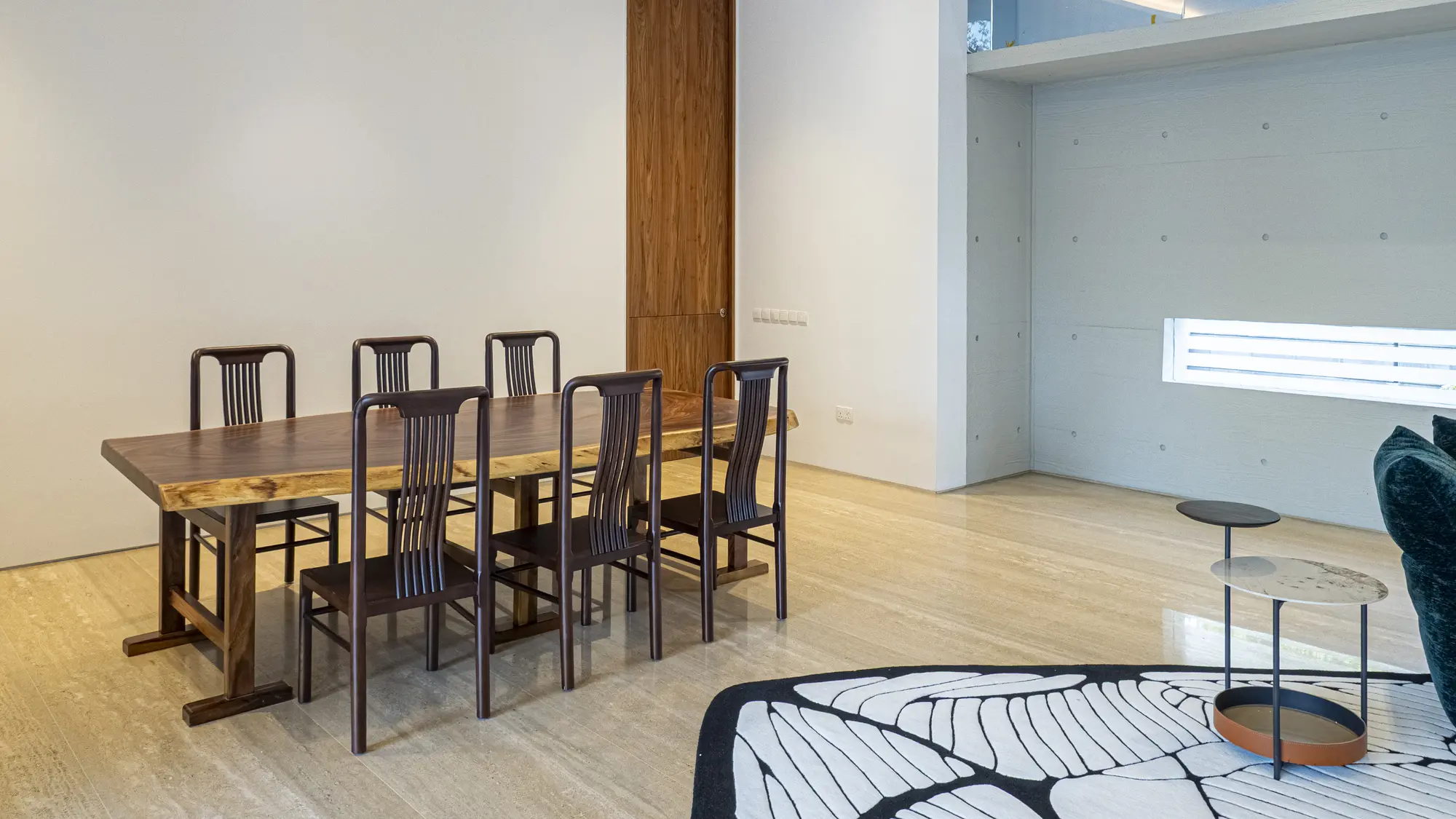 Open-plan living room and solid timber dining area