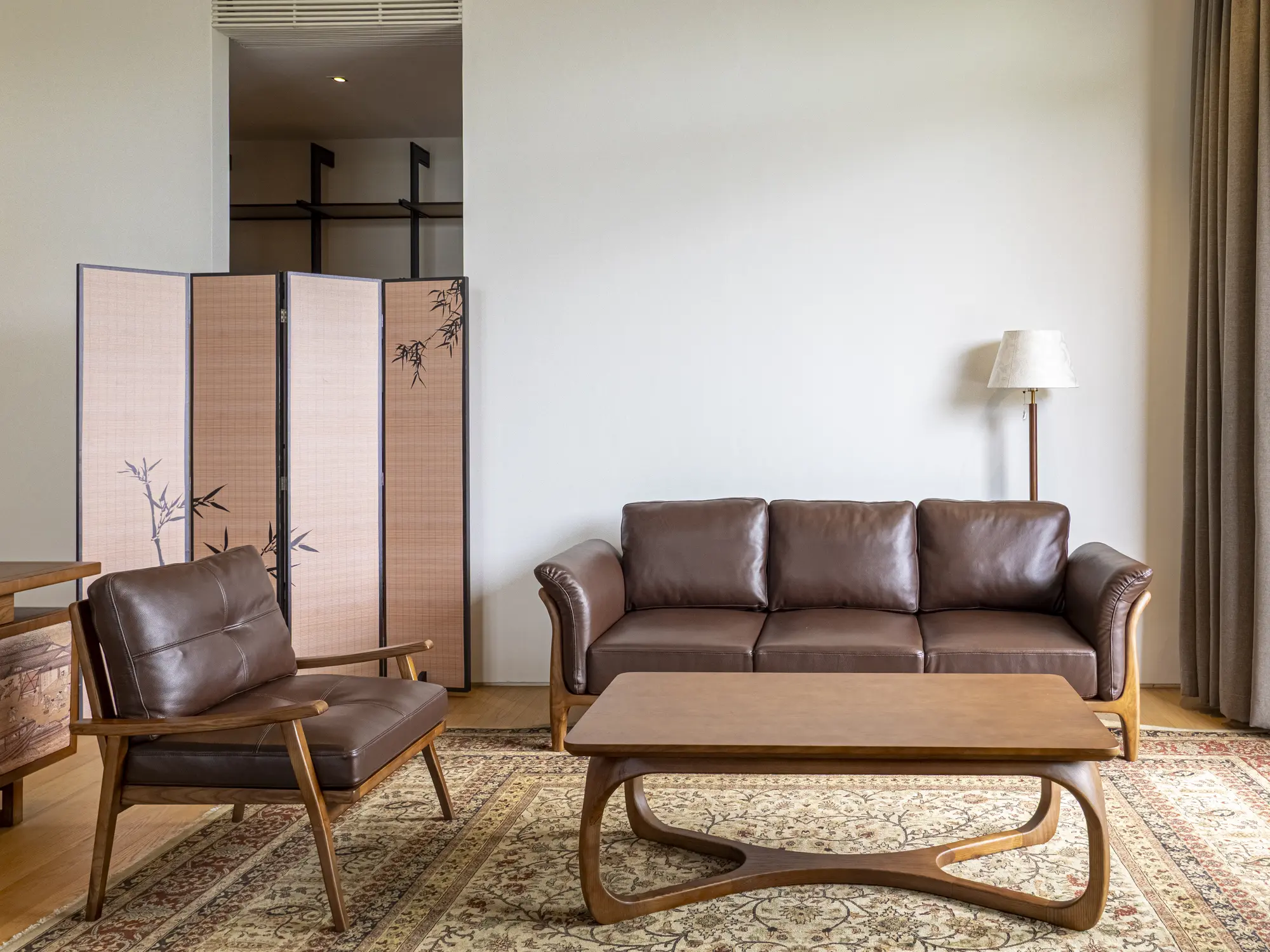 Leather sofa, armchair and timber coffee table